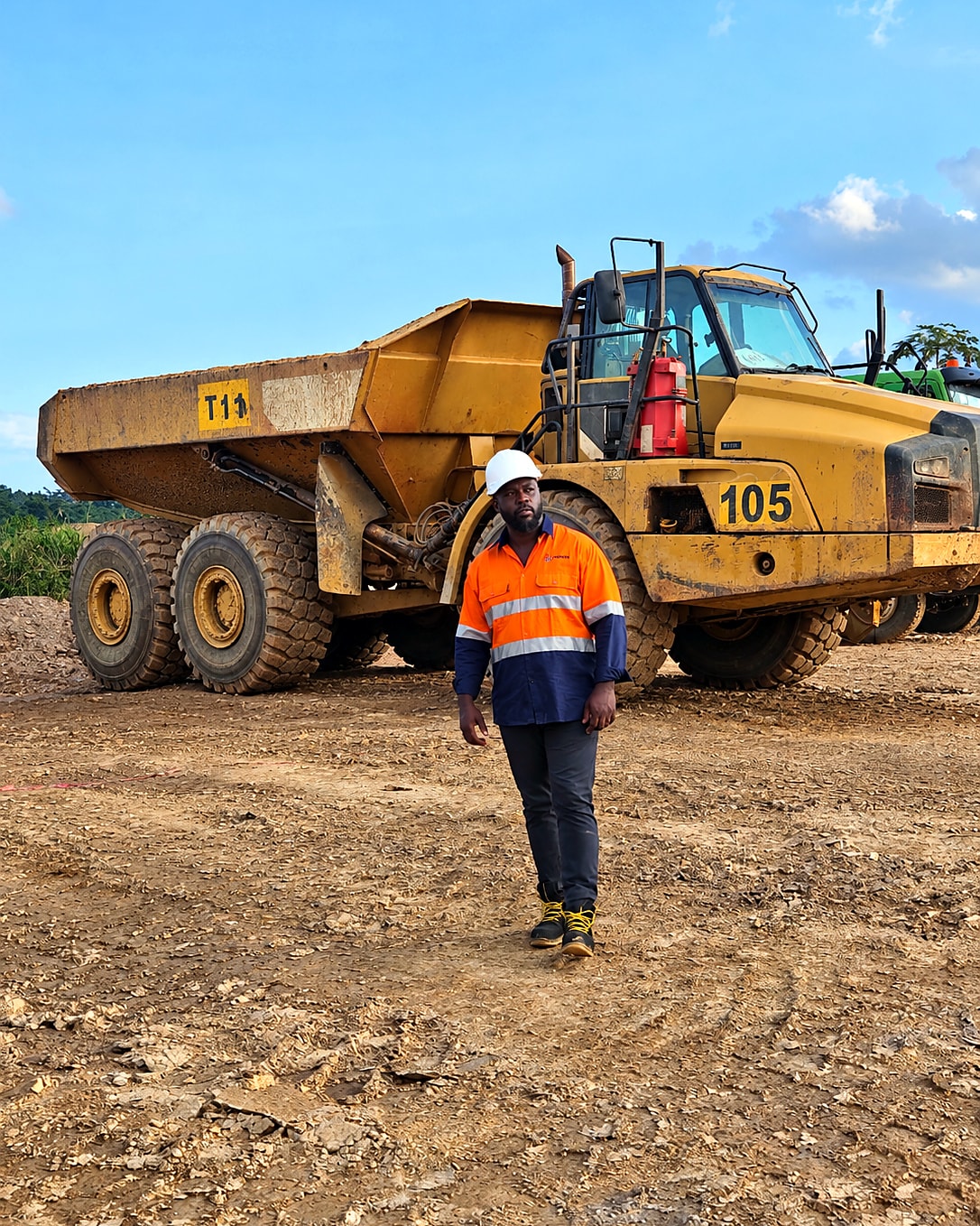 Operator with articulated dump truck